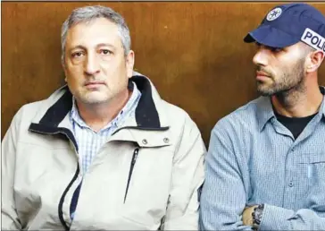  ?? JACK GUEZ/AFP ?? Nir Hefetz (left) appears in the Israeli Justice Court in Tel Aviv, in one of the graft probes threatenin­g the Israeli prime minister, on February 22.