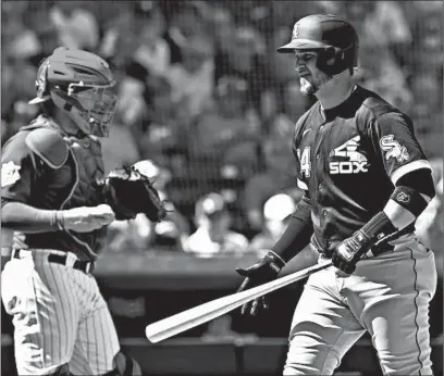  ?? SUE OGROCKI/AP ?? The White Sox’s Yasmani Grandal, right, would love to face the Cubs and catcher Victor Caratini in the World Series.