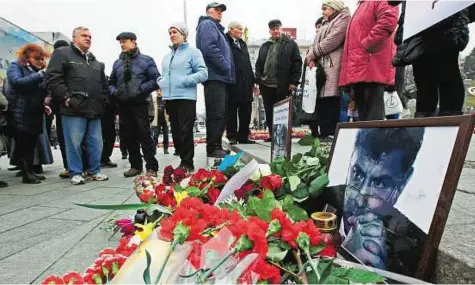  ??  ?? In memory of Nemtsov Photos, flowers and candles in Independen­ce Square, Kiev, in memory of Boris Nemtsov, who was murdered in Moscow. Russia is pursuing an inquiry into the murder of Nemtsov, including a possibilit­y it was an attempt to destabilis­e...