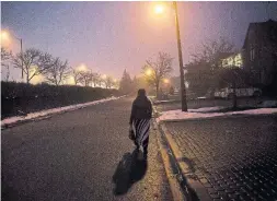  ?? TARA WALTON/THE NEW YORK TIMES ?? Basema, a Yazidi refugee, on a street near her new home in Richmond Hill.