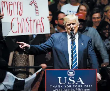  ?? PAUL SANCYA/AP ?? President-elect Donald Trump speaks to supporters about saying “Merry Christmas” during a rally in Grand Rapids, Mich.