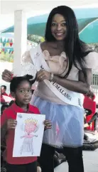  ??  ?? Tema Nkosi holds a picture she drew of Mrs Mpumalanga, Ntombi Ngobese.