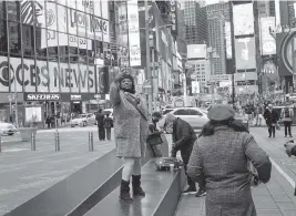  ?? ?? Times Square in New York City is a prime spot for people to take selfies.