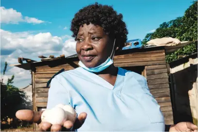  ?? Picture: AFP ?? LEAVING. Virginia Mutsamwira, 52, a senior nurse, near the small shop she runs from home to supplement her income, as the main breadwinne­r for her extended family of eight in Harare.