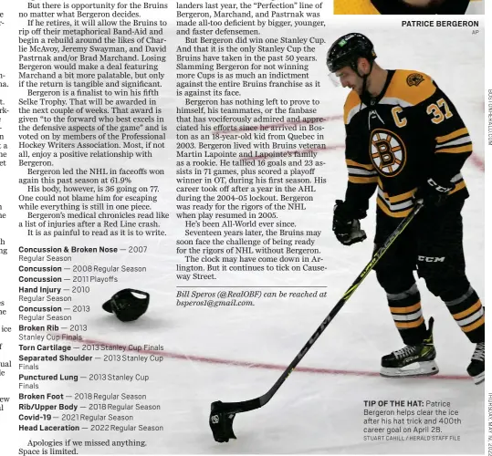  ?? STUART CAHILL / HERALD STAFF FILE ?? TIP OF THE HAT: Patrice Bergeron helps clear the ice after his hat trick and 400th career goal on April 28.