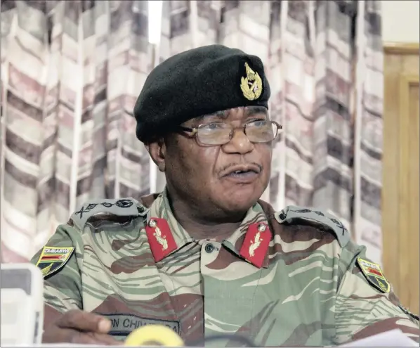  ??  ?? LISTEN TO ME: Zimbabwe’s Army Commander Constantin­o Chiwenga said that the military “will not hesitate to step in,” days after President Robert Mugabe fired his vice-president who enjoyed the support of the army and was once viewed as a potential...