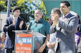  ?? Mel Melcon Los Angeles Times ?? SENATE President Pro Tem Kevin de León, left, and Assemblyma­n Miguel Santiago, right, were coauthors of SB 54, the California Values Act, last year.