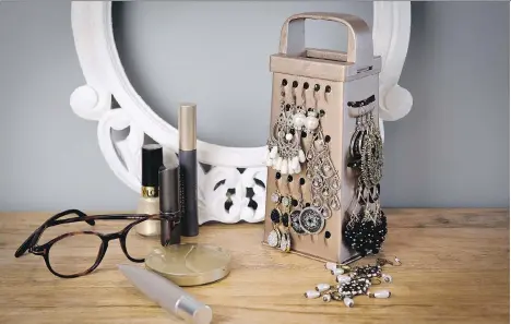 ?? MICHAEL CARSON FOR RUST OLEUM CONSUMER BRANDS ?? An old cheese grater is re-purposed — or upcycled — into a jewelry holder.