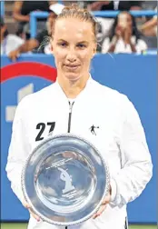  ??  ?? Svetlana Kuznetsova celebrates with her trophy.