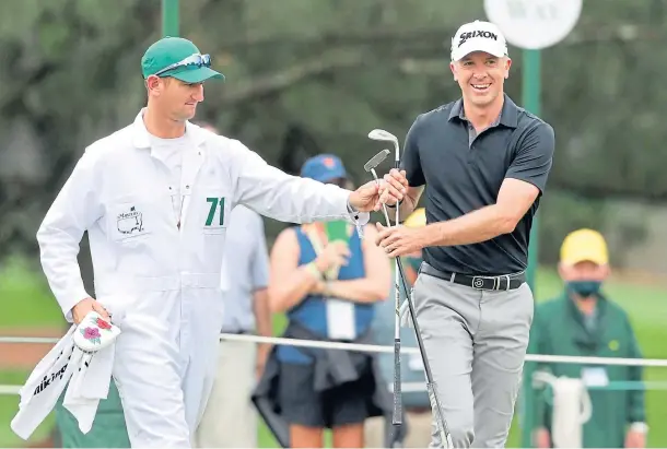  ??  ?? ALL SMILES: Martin Laird with his caddie Kevin McAlpine after his chip to the second green set up a birdie in the final round.