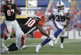  ?? JEFFREY T. BARNES - THE ASSOCIATED PRESS ?? FILE - In this Aug. 26, 2018, file photo, Buffalo Bills running back Keith Ford (35) rushes past Cincinnati Bengals’ Brandon Wilson (40) during the second half of a preseason NFL football game in Orchard Park, N.Y. The Bills have promoted Ford from their practice squad to provide insurance with starter LeSean McCoy and backup Chris Ivory nursing injuries.