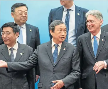  ?? /Reuters ?? Cozying up: Chinese Vice-Premier Ma Kai and Britain’s Chancellor of the Exchequer Philip Hammond attend the UK-China economic dialogue in Beijing on Saturday.