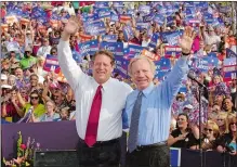  ?? ?? Below, Democratic presidenti­al candidate Vice President Al Gore and his running mate, Lieberman, wave to supporters in Jackson, Tenn., Oct. 25, 2000.