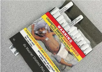  ?? CAMILLE BAINS, THE CANADIAN PRESS ?? A pack of cigarettes with health warnings printed on the filter tips of each individual cigarette. Retailers must sell only packages like these by July 31.