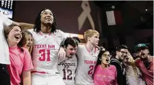  ?? Photos by Logan Hannigan-Downs/Associated Press ?? With a 7-1 start to SEC play, these are good times for Javonte Brown (31) and the A&M faithful, but because of some nonconfere­nce slip-ups more work is needed before the dancing takes place when it’s most desired — in March.