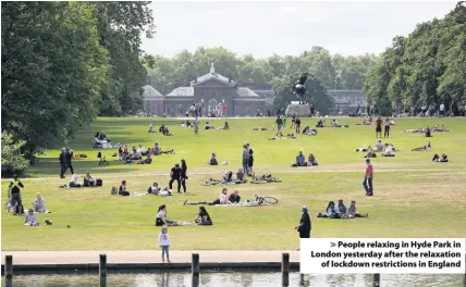  ??  ?? > People relaxing in Hyde Park in London yesterday after the relaxation of lockdown restrictio­ns in England