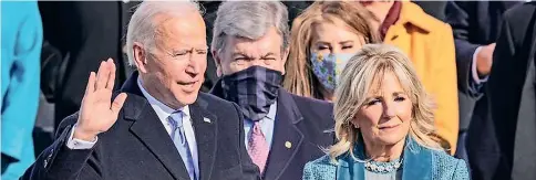  ??  ?? FRACTURED AMERICA’S POLLITICAL HEALER: 78 year old Joe Biden is sworn in as the 46th President of the United States of America with his second wife First Lady Jill by his side