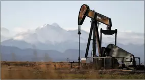  ?? DAVID ZALUBOWSKI — THE ASSOCIATED PRESS FILE ?? A pump jack over an oil well along Interstate 25near Dacono, Colo., is shown in 2018. Federal courts have delivered a string of rebukes to the Trump administra­tion over what they found were failures to protect the environmen­t and address climate change as it promotes fossil fuel interests and the extraction of natural resources from public lands.