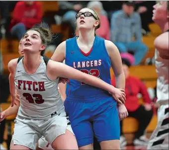  ?? SARAH GORDON/THE DAY ?? Fitch’s Alyssa Virtue (33) boxes out Waterford’s Anna Schleck under the basket during the Falcons’ 45-28 ECC Division II girls’ basketball victory on Tuesday night in Groton.