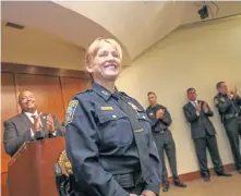  ?? NICOLAUS CZARNECKI PHOTOS / HERALD STAFF ?? CIVIL SERVICE IN HER BLOOD: Lt. Therese Kozmiski receives a round of applause after being promoted to captain during a ceremony at Boston Police Department Headquarte­rs yesterday.