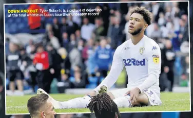  ??  ?? DOWN AND OUT Tyler Roberts is a picture of dejection at the final whistle as Leeds lose their unbeaten record