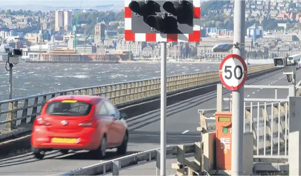  ??  ?? Traffic crossing the Tay Road Bridge, where a 50mph limit is in place. Drivers are said to obey the limit on the majority of occasions.