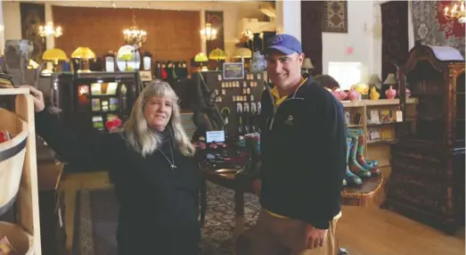  ??  ?? Entreprene­ur Cliff Miller IV said his business depends upon getting online. “We probably couldn’t survive without the internet. Our entire point of sale system is hooked into it,” said Miller, at his Sperryvill­e antiques shop with manager Maggie Morris.