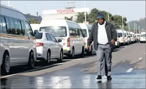  ?? PHOTO: REUTERS ?? Minibus taxi operators block the entrance to the Toyota manufactur­ing plant during morning rush hours in Durban yesterday.