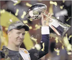  ?? MATT YORK ASSOCIATED PRESS ?? Denver quar terback Peyton Manning holds up the trophy af ter the Broncos defeated the Carolina Panthers 24-10 in Super Bowl 50 Sunday in Santa Clara , Calif. It was Manning’s second Super Bowl victor y — and possibly the la st game of his career.