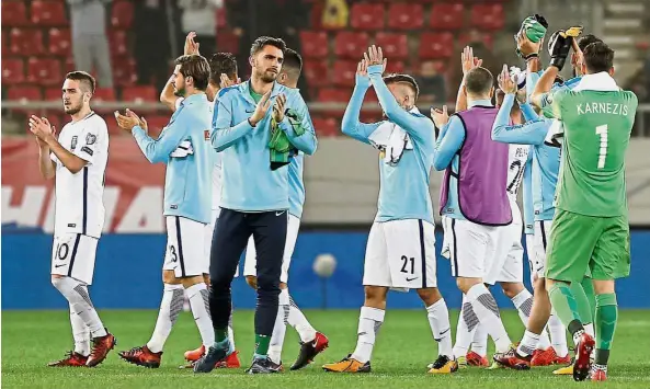  ??  ?? Thanks a lot: Greece players applauding their fans after the World Cup playoff second-leg clash against Croatia in Athens on Sunday. Greece lost 4-1 on aggregate to crash out of the World Cup. — Reuters
