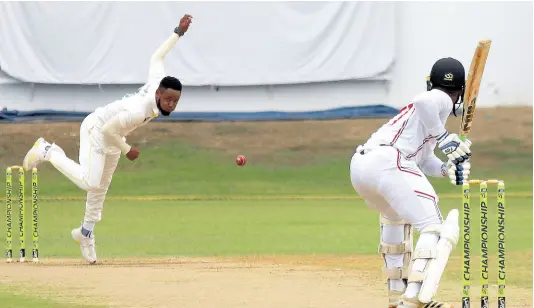  ?? PHOTO BY LENNOX ALDRED ?? Jamaica Scorpions debutant, Andre McCarthy (left) bowls to Trinidad and Tobago Red Force opener Cephas Cooper during the opening day of their West Indies Championsh­ip final-round match at Sabina Park yesterday.