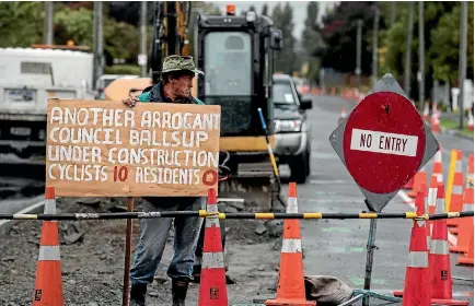  ?? PHOTO: IAIN MCGREGOR/FAIRFAX NZ ?? Papanui resident John Button protesting about Grassmere St roading changes on Wednesday.