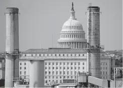  ?? Saul Loeb, Afp/getty Images ?? The chimney stacks of the Capitol Power Plant, a natural gas and coal burning power plant is seen near the U.S. Capitol in Washington, D.C., August 22.