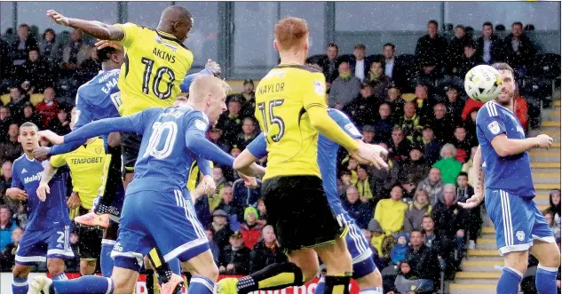  ?? PICTURES: Richard Holmes/ProSports ?? BREWING UP A STORM: Lucas Akins scores to make it 2-0 to Burton Albion