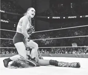  ?? WWE ?? Ronda Rousey puts an armbar on Alicia Fox. She wrestles Alexa Bliss Sunday.