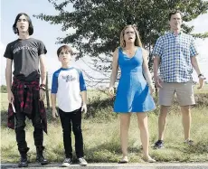  ??  ?? Charlie Wright, left, Jason Drucker, Alicia Silverston­e and Tom Everett Scott appear in a scene from the latest in the Diary of a Wimpy Kid franchise.