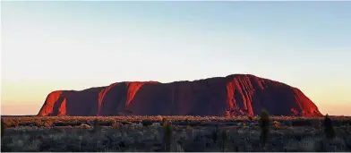  ??  ?? The sun rising over the iconic monolith Uluru. Cultural heritage: