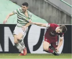  ??  ?? 0 Ryan Christie tries to escape the clutches of Dean Campbell