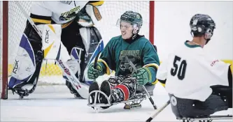  ?? JEFF MCINTOSH THE CANADIAN PRESS ?? Ryan Straschnit­zki in a sledge hockey game in Calgary on Sept. 5.