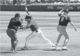  ?? ROB SCHUMACHER/THE REPUBLIC ?? The Diamondbac­ks’ Daulton Varsho is caught stealing at second base by the Padres’ Jake Cronenwort­h in the first inning during a spring training game at Salt River Fields on Thursday.