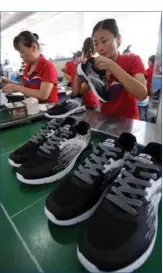  ?? PROVIDED TO CHINA DAILY ?? Workers produce sneakers at an Anta Sports Products Ltd plant in Jinjiang, Fujian province.