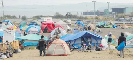  ??  ?? Nanaimo’s downtown encampment is known as DisconTent City. More than 100 people are living on the city-owned property.