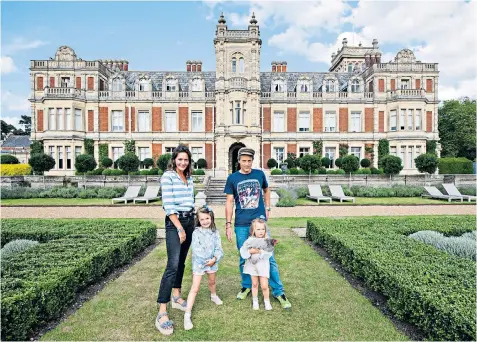  ??  ?? Lady Somerleyto­n, above, with her husband Hugh Crossley, the 4th Baron Somerleyto­n, and children Christabel, five, and Margot, three. Left, the emerald art deco pendant, and, right, the Pakefield branch of Morrisons where the pendant may have been lost