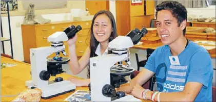  ??  ?? Close look: Two Forest View High School pupils, Leonie Nugroho and Western Wilson, were among the 40 Year 12 students who attended the Hill Laboratori­es Waikato Science Summer School at the University of Waikato.