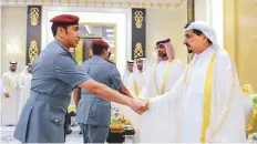  ?? WAM ?? Shaikh Humaid and Shaikh Ammar of Ajman receive Eid greetings from officials at Al Zaher Palace.