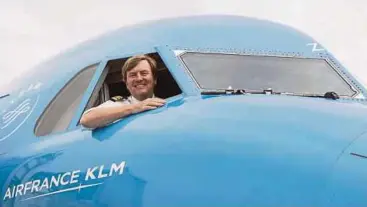  ?? AP PIC ?? Dutch King WillemAlex­ander looking out from a KLM Cityhopper aircraft at Schiphol Airport, Amsterdam.