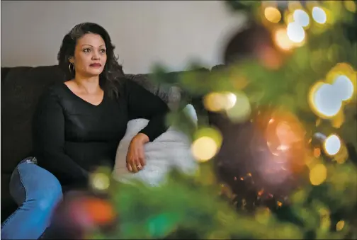  ?? Morgan Timms ?? Shannon Cisneros, who has experience­d homelessne­ss, poses for a portrait Monday (Dec. 10) by her recently decorated Christmas tree in her Taos home.