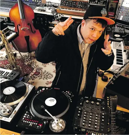  ??  ?? Kid Koala, a.k.a. Eric San, in his Montreal studio surrounded by beat making machinery. He vows that the Vinyl Vaudeville Floor Kids Edition will be “the silliest dance party in the history of silly parties.”