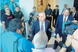  ?? MIKE STOCKER/SUN SENTINEL ?? Andrew Pollack, the father of Meadow Pollack, one of the victims in the Marjory Stoneman Douglas shooting, talks with the media Wednesday after a hearing regarding former deputy Scot Peterson.