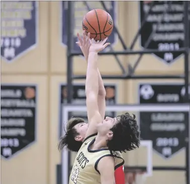  ?? PHOTO COURTESY JESUS ‘JQ’ QUESADA III ?? Vincent Memorial Catholic High School Scot Raul Villareal (foreground) goes up for a tip-off against Imperial’s David Scariano during a Desert League boys basketball game held Friday, January 13, at the Scots’ gym, in Calexico.